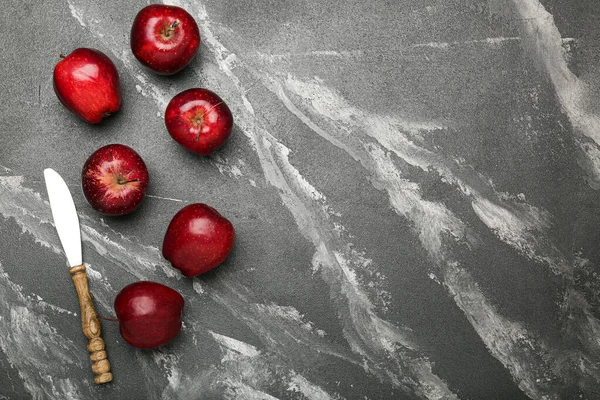 Fresh red apples. On a black stone background. Top view.