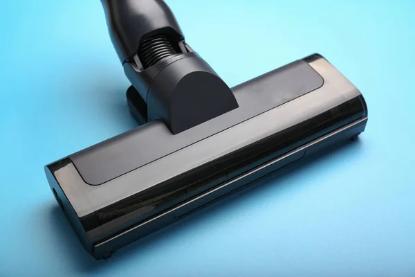Vacuum cleaner on a blue background. Top view. Cleaning concept