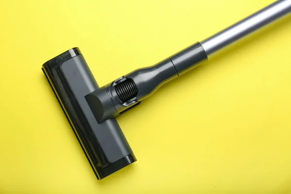 vacuum cleaner on yellow background. View from above
