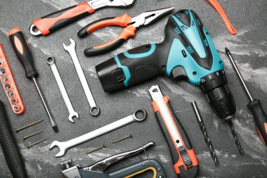 Set of various construction tools on a black background. Tools for home repair. Work at a construction site.