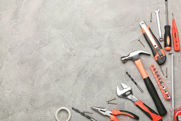 Set of various construction tools on a gray background. Tools for home repair. Work at a construction site. top view. Space for text
