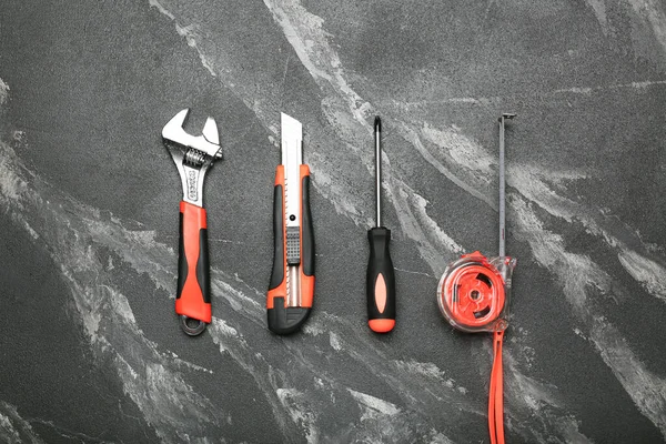 Set of various construction tools on a black background. Tools for home repair. Work at a construction site.