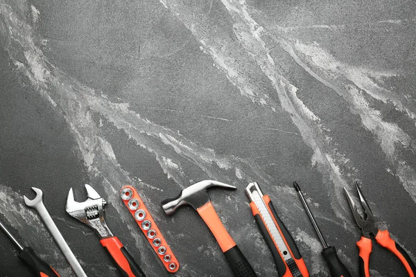 Set of various construction tools on a black background. Tools for home repair. Work at a construction site. Top view. Space for text