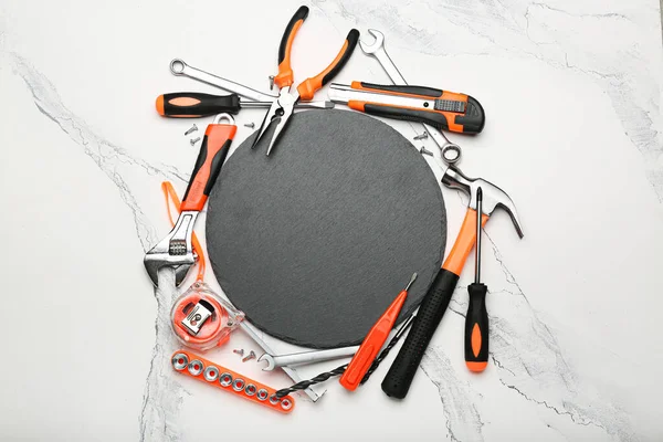 Set of various construction tools near laptop on a white background. Tools for home repair. Work at a construction site. top view. Space for text