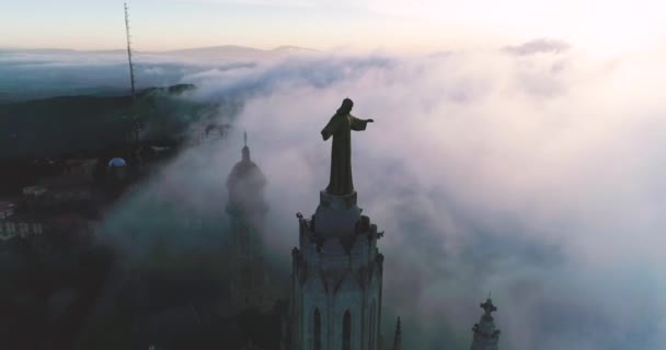 Aerial circling around Tibidabo in the Morning. Low to the Ground Fog at Sunrise — Vídeos de Stock