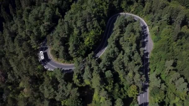Bird eve view of a card driving on a curvy winding beautiful road — Stockvideo