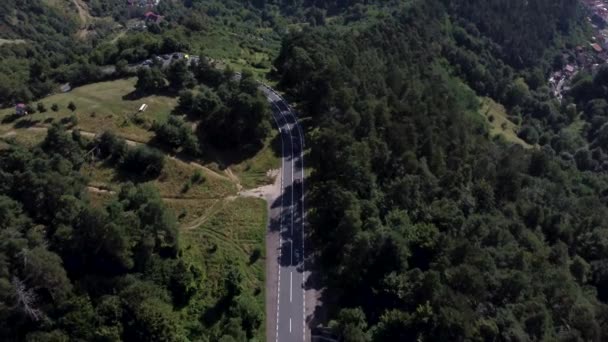 An aerial Drone Landscape of a road and a city in Transylvania. — Wideo stockowe