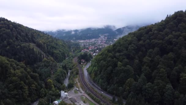 Aerial view of a foggy morning close to the railways tracks,roads and small city — Video