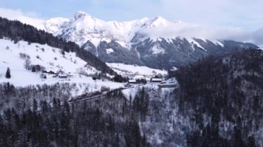 Aerial view of a famous ski resort in French Alps. After hiking to snowy peaks