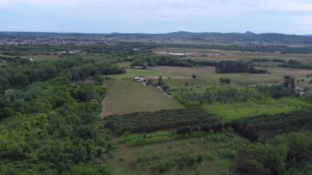 Aerial Drone Footage of forest over spring mountains, hills and meadows — 비디오