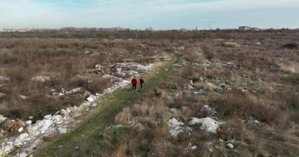 Two People Walking Huge Aste Garbade Dump Rubbish Landill Bucharest — Stock Video