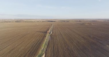 Drone shot of a beatiful landscape of an open field in Romania. Rural scene. High quality 4k Aerial Cinematic Drone DJI MAVIC 3 5.1k footage made in Bragadiru, Romania in January 2022