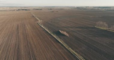 Drone shot of a beatiful landscape of an open field in Romania. Rural scene. High quality 4k Aerial Cinematic Drone DJI MAVIC 3 5.1k footage made in Bragadiru, Romania in January 2022