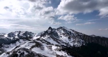Aerial drone footage of Ciucas Mountain summit. Top of the mountain. Sunny day. High-quality 4k DJI MAVIC 3 PRO 5.1k footage made in Ciucas, Romania in March 2022