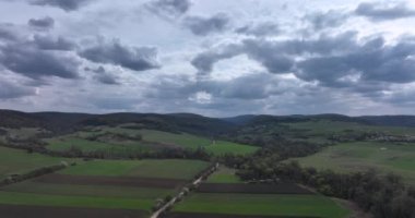 Drone moving forward high above a prairie setting of autumn countryside views. High-quality 5.1k DJI Mavic 3 4k footage shoot in May 2022 in South Romania