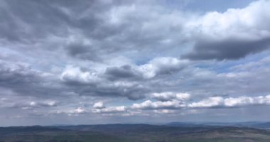 White clouds floating in the sky. Blue sky white clouds. Puffy fluffy clouds. High-quality 5.1k DJI Mavic 3 4k footage shoot in May 2022 in South Romania