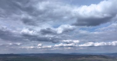 White clouds floating in the sky. Blue sky white clouds. Puffy fluffy clouds. High-quality 5.1k DJI Mavic 3 4k footage shoot in May 2022 in South Romania