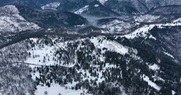 Aerial Top Cinematic Winter Snow Covered Country Road Picks High — Vídeos de Stock