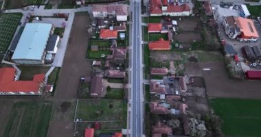 Aerial drone flight over a small farming community in rural Romania. High-quality 5.1k DJI Mavic 3 4k footage shoot in May 2022 in South Romania