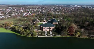 Drone footage of Mogosoaia City and Palace from above on a beautiful sunny day. High-quality DJI Mavic 3 5.1k and 4k footage were made in January 2022 in Romania on a sunny cold day.