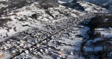 Beautiful winter mountain landscape, Hunedoara Country, Romania covered in snow. High-quality DJI Mavic 3 5.1k and 4k footage shot in January 2022 in Borsa, Romania a town in eastern Maramures County