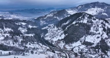 Winter forest nature snow covered winter trees alpine landscape late night. High-quality DJI Mavic 3 5.1k and 4k footage shot in January 2022 in Borsa, Romania a town in eastern Maramures County