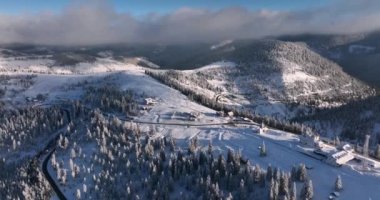 The monastery Pirslop and the Pass In Maramuses are Covered in the snow on a sunny day.High-quality DJI Mavic 3 5.1k and 4k footage in January 2022 in Borsa, Romania a town in eastern Maramures County