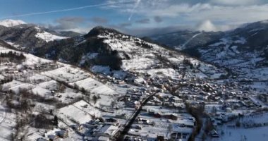 Beautiful winter mountain landscape, Hunedoara Country, Romania covered in snow. High-quality DJI Mavic 3 5.1k and 4k footage shot in January 2022 in Borsa, Romania a town in eastern Maramures County