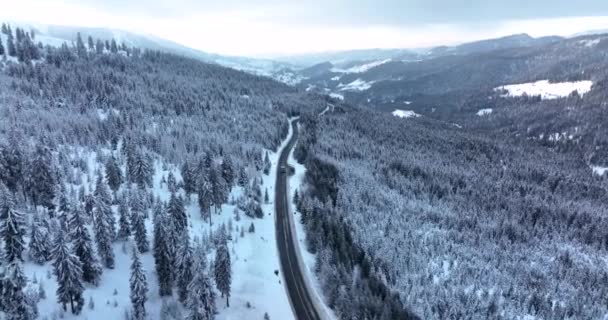 Drone Flying Narrow Winding Road Middle Snow Covered White Mountain — Stock videók
