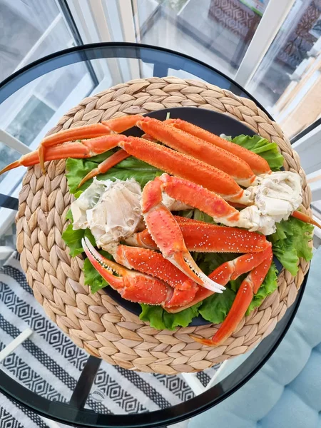 A hot dish of snow crab on a beautiful plate