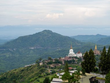 White buddha and mountain at Phetchabun, Thailand.