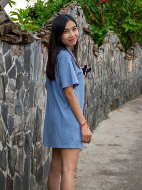 Asian woman and road at Phetchabun, Thailand.