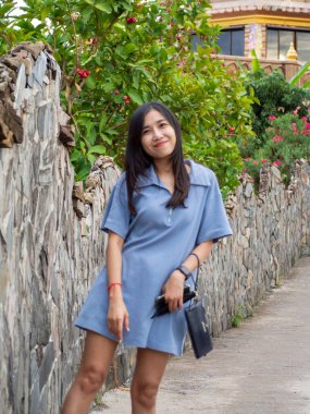 Asian woman and road at Phetchabun, Thailand.