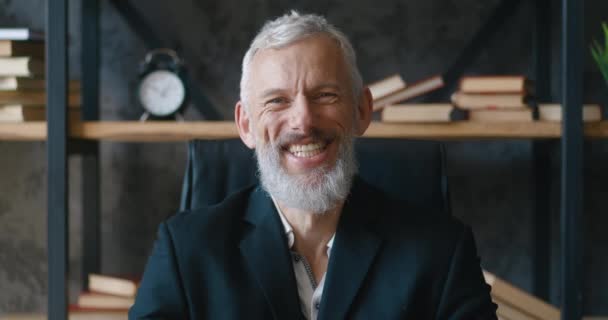 Smiling bearded mature professional CEO businessman looking at camera. Close-up portrait of happy confident handsome smart adult entrepreneur, leader, manager posing in office — Stockvideo