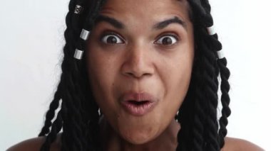 Headshot of a delighted and ecstatic woman with surprised emotions. Astonishment, surprise, happiness, stupefaction