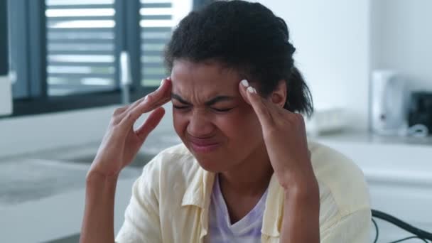 Headshot Stressed Anxious African Woman Massaging Temples Sitting Home Interior — Video