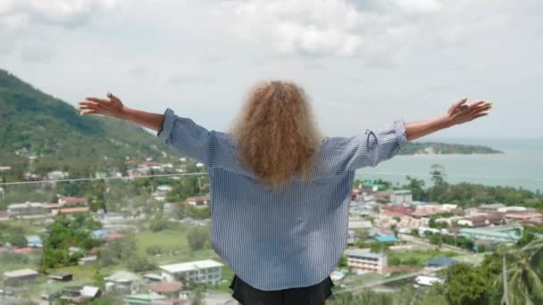 Back View Redhead Woman Raising Arms Sky Enjoys Beautiful View — Stock Video