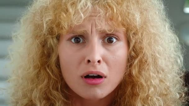 Young Curly Redhead Woman Covers Her Mouth Feeling Afraid Frightened — Stock Video