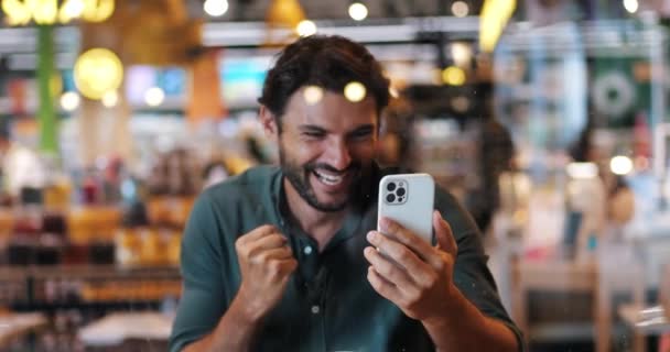 Excited Football Fan Watches Match Mobile Phone Expresses Excitement Team — Stock Video