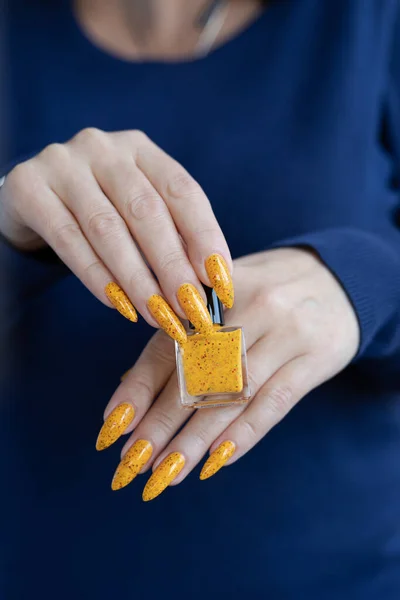 cropped image of woman with beautiful fresh colored manicure