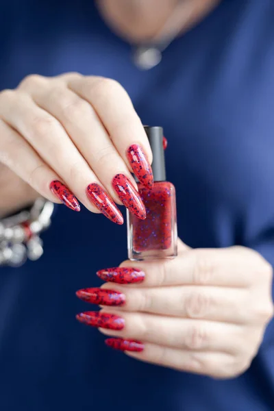 cropped image of woman with beautiful fresh colored manicure