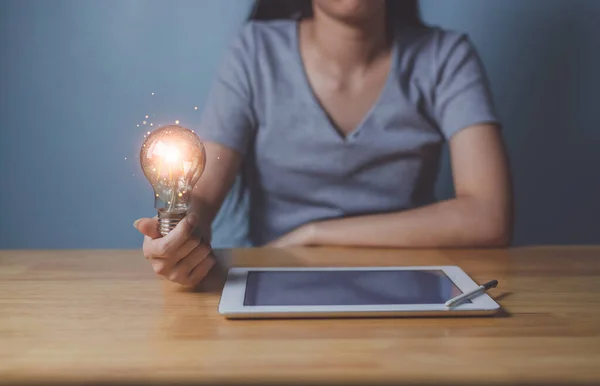 Young Woman Hand Holding Light Bulb Lifted Office Idea Creating —  Fotos de Stock