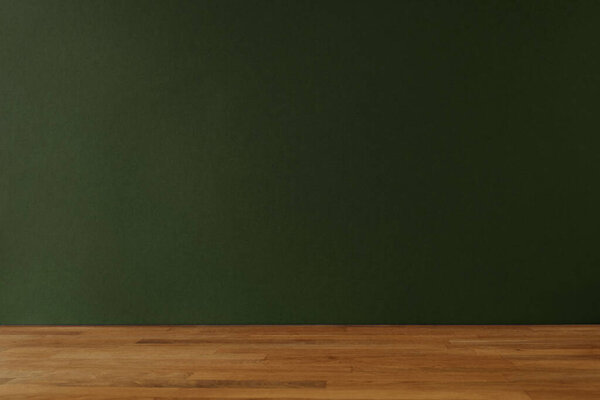 Dark green background for copy space and wooden table