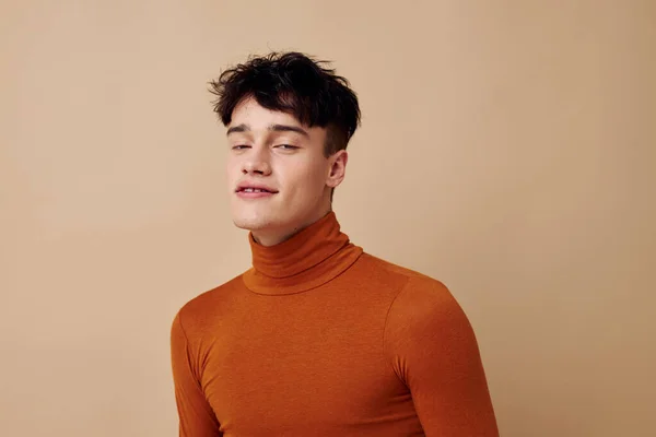 Portrait of a young man brown turtleneck posing fashion Lifestyle unaltered — Stock fotografie