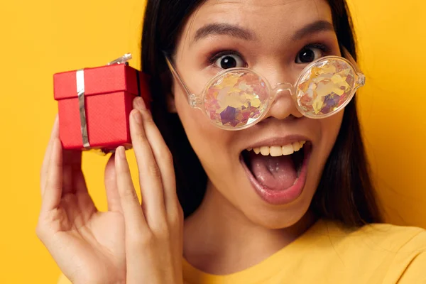 Portrait Asian beautiful young woman with gift boxes in hands fun posing isolated background unaltered — 图库照片