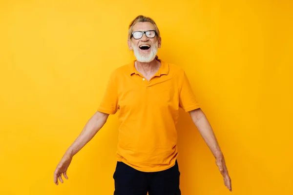 Portrait of happy senior man with a gray beard in glasses cropped view — Photo