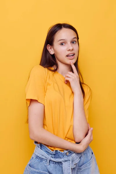 Attractive woman in a yellow t-shirt emotions summer style isolated background — Stock Photo, Image