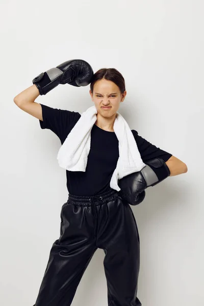 Young beautiful woman with towel boxing black gloves posing sports fitness training — Stock Photo, Image