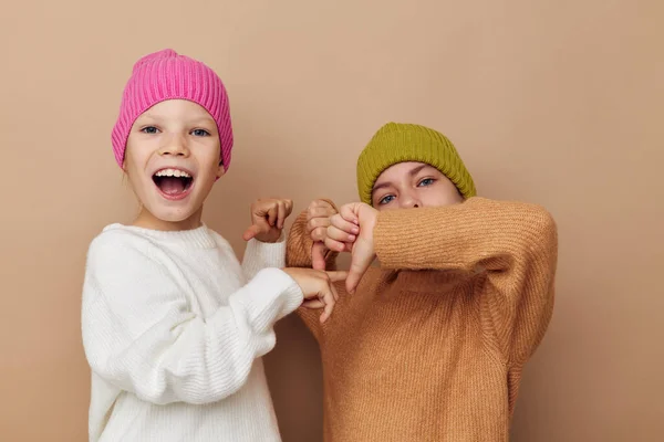Two cute little girls wearing hats fashion childhood — 图库照片