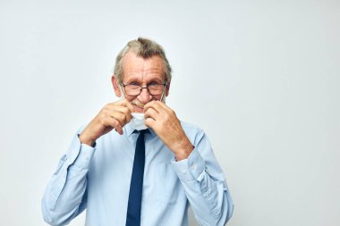 elderly man in shirt with tie medical mask safety isolated background